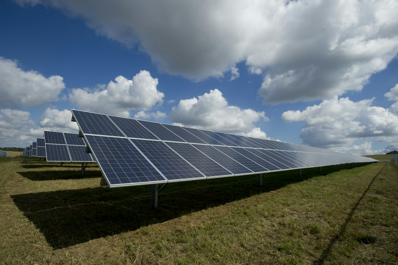 Utility-scale solar PV array under a bright sky